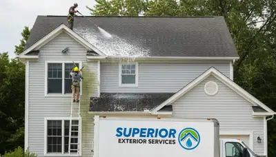 Professional roof cleaning removing algae and debris in humid Houston, TX by Next Level Exteriors